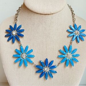 Sparkly rhinestone flower statement necklace in blues with silvertone chains
